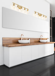 Joliet 5 Light Vanity in Burnished Brass in a room setting