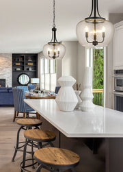 Joliet 3 Light 15.75" Pendant in Matte Black in a room setting