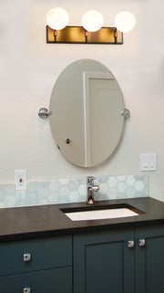 Parsons 3 Light 24" Vanity in Matte Black + Olde Brass in a room setting