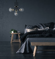 Parsons 4 Light 22" Chandelier in Matte Black + Brushed Nickel in a room setting