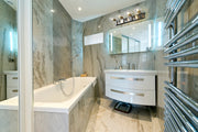 Parsons 4 Light 33.25" Vanity in Matte Black + Brushed Nickel in a room setting