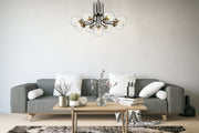 Parsons 9 Light 32" Chandelier in Matte Black + Brushed Nickel in a room setting
