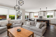 Vertical 3 Light 18" Pendant in Matte Black + Brushed Nickel in a room setting