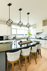 Vertical 1 Light 11.25" Pendant in Bronze + Olde Brass in a room setting