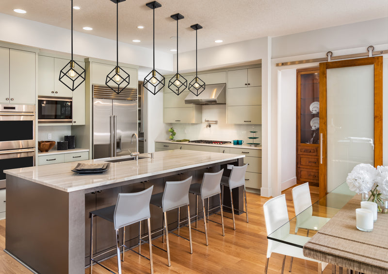 Vertical 1 Light 11.25" Pendant in Matte Black + Brushed Nickel in a room setting