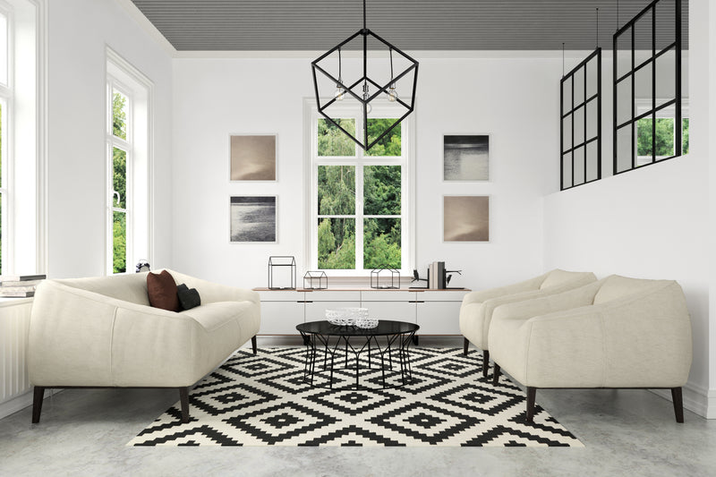 Vertical 4 Light 34" Pendant in Matte Black + Brushed Nickel in a room setting
