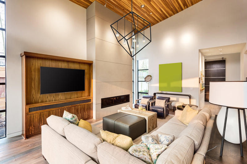 Vertical 7 Light 44" Pendant in Matte Black + Brushed Nickel in a room setting