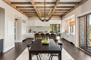 Haylie 10 Light 44" Linear Pendant in Matte Black + Olde Brass in a room setting
