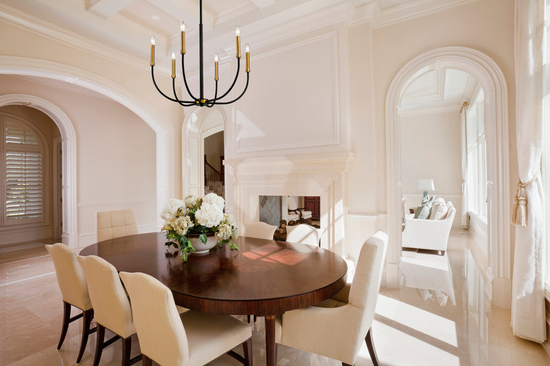 Haylie 6 Light 26" Chandelier in Matte Black + Olde Brass in a room setting