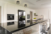 Kube 1 Light 5.75" Flush Mount in Matte Black + Chrome in a room setting