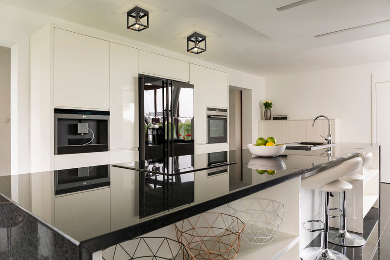 Kube 1 Light 5.75" Flush Mount in Matte Black + Chrome in a room setting