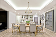 Barclay 8 Light 26" Chandelier in Olde Brass in a room setting
