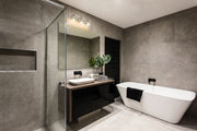 Harper 3 Light 23" Vanity in Brushed Nickel in a room setting