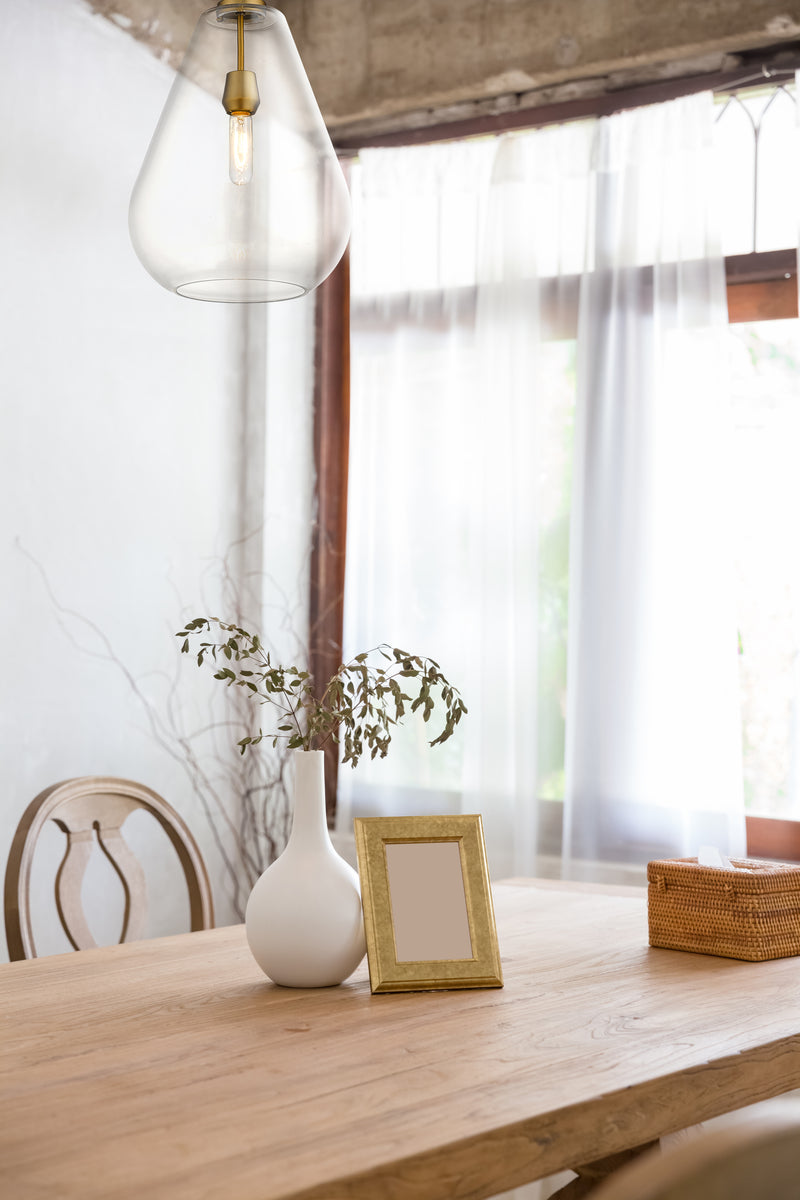 Ayra 1 Light 12" Pendant in Olde Brass in a room setting