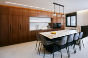 Chloe 3 Light 36" Linear Pendant in Matte Black in a room setting
