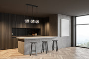 Chloe 3 Light 36" Linear Pendant in Matte Black in a room setting