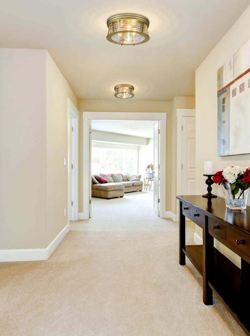 Cape Harbor 3 Light 16" Flush Mount in Rubbed Brass in a room setting