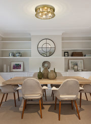 Cape Harbor 4 Light 20" Flush Mount in Rubbed Brass in a room setting