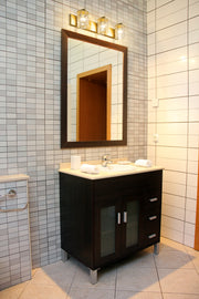 Beckett 3 Light 23" Vanity in Olde Brass in a room setting