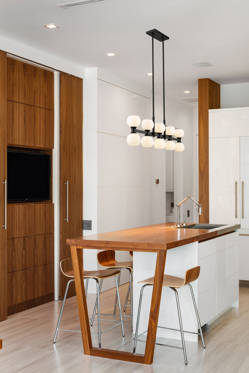 Artemis 10 Light 40" Linear Pendant in Matte Black in a room setting