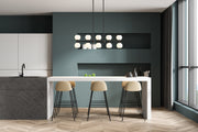 Artemis 10 Light 40" Linear Pendant in Matte Black in a room setting