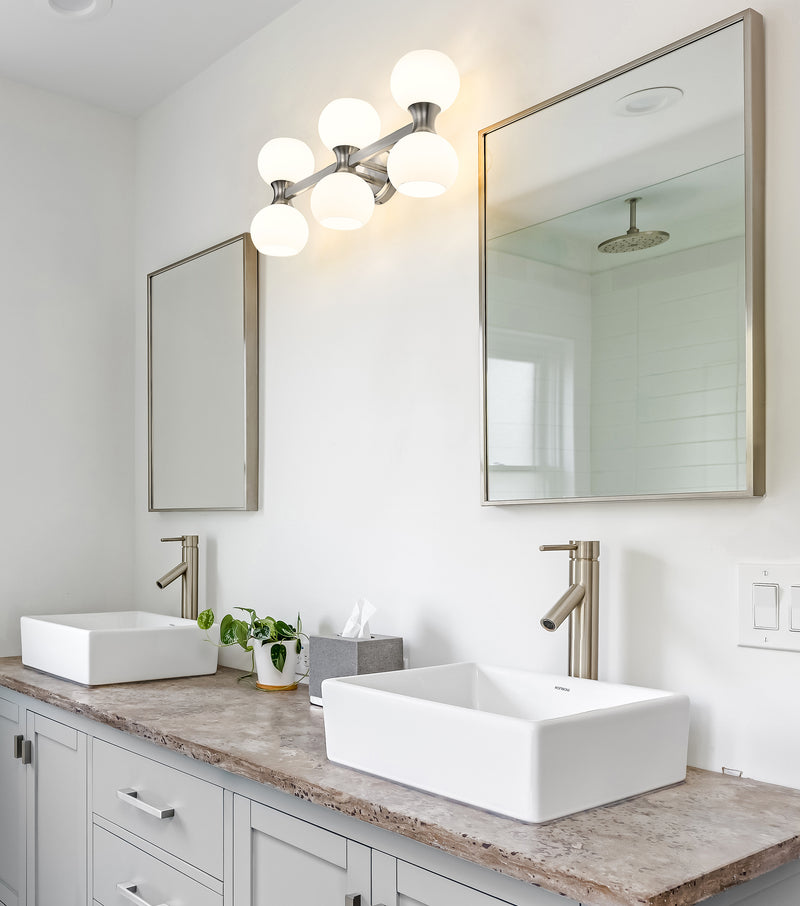 Artemis 6 Light 25" Vanity in Brushed Nickel in a room setting
