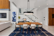 Counterpoint 5 Light 42" Linear Pendant in Matte Black in a room setting
