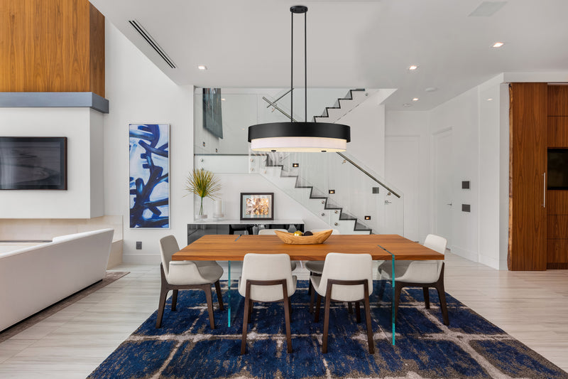 Counterpoint 5 Light 42" Linear Pendant in Matte Black in a room setting