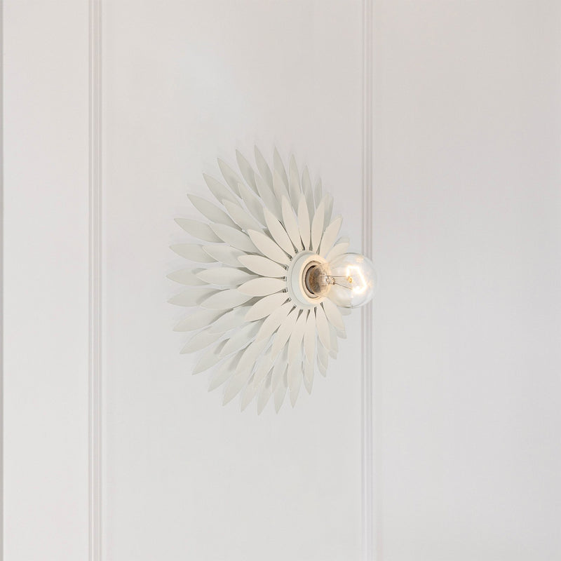 Broche 1 Light 11" Sconce in Matte White in a room setting