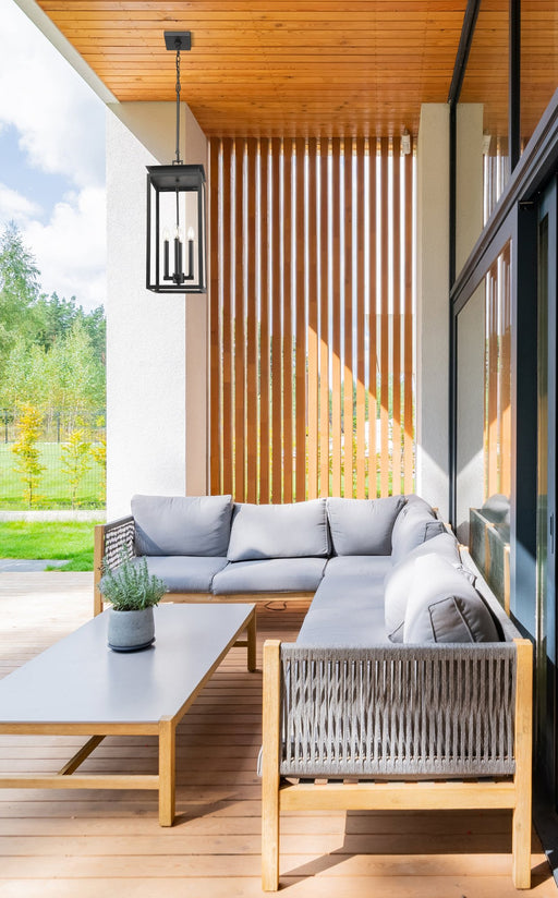 Nova 4 Light 10.5" Outdoor Chain Mount Ceiling Fixture in Black in a room setting