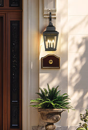 Raphael 3 Light 12" Outdoor Wall Light in Sand Black in a room setting