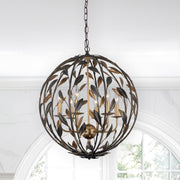 Broche 6 Light 21" Chandelier in English Bronze + Antique Gold in a room setting