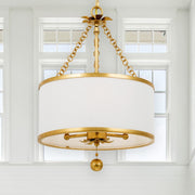 Broche 3 Light 14" Chandelier in Antique Gold in a room setting