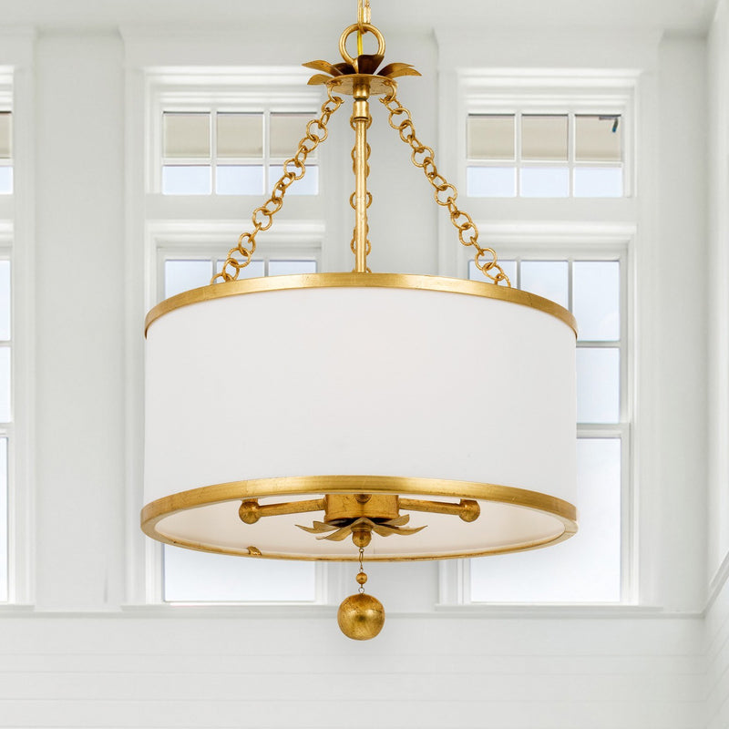 Broche 3 Light 14" Chandelier in Antique Gold in a room setting