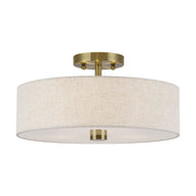 Meridian 3-Light 15" Oatmeal Shade Semi-Flush Mount in Antique Brass