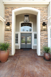 Broughton 4 Light 12.5" Outdoor Wall Light in Black in a room setting