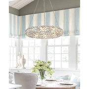 Palla 8 Light 32" Chandelier in Antique Silver in a room setting