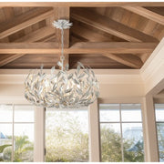 Broche 6 Light 27" Chandelier in Antique Silver in a room setting