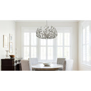 Broche 6 Light 27" Chandelier in Antique Silver in a room setting