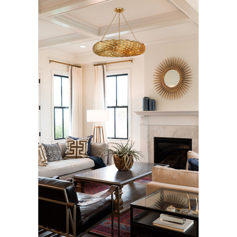 Broche 8 Light 33.5" Pendant in Antique Gold in a room setting
