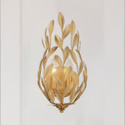 Broche 2 Light 8.25" Sconce in Antique Gold in a room setting