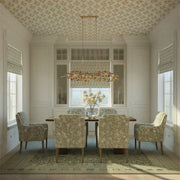 Broche 6 Light 50.5" Linear Chandelier in Antique Gold in a room setting