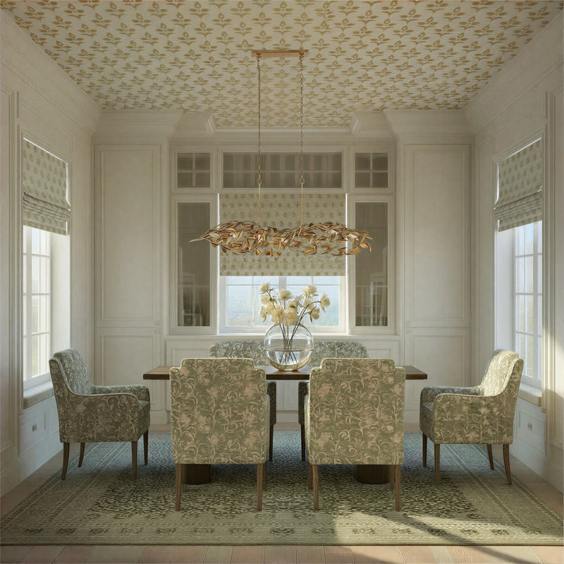 Broche 6 Light 50.5" Linear Chandelier in Antique Gold in a room setting