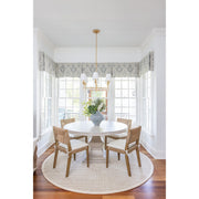 Broche 6 Light 32" Chandelier in Antique Gold in a room setting