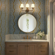 Broche 3 Light 25" Bathroom Vanity in Antique Gold in a room setting