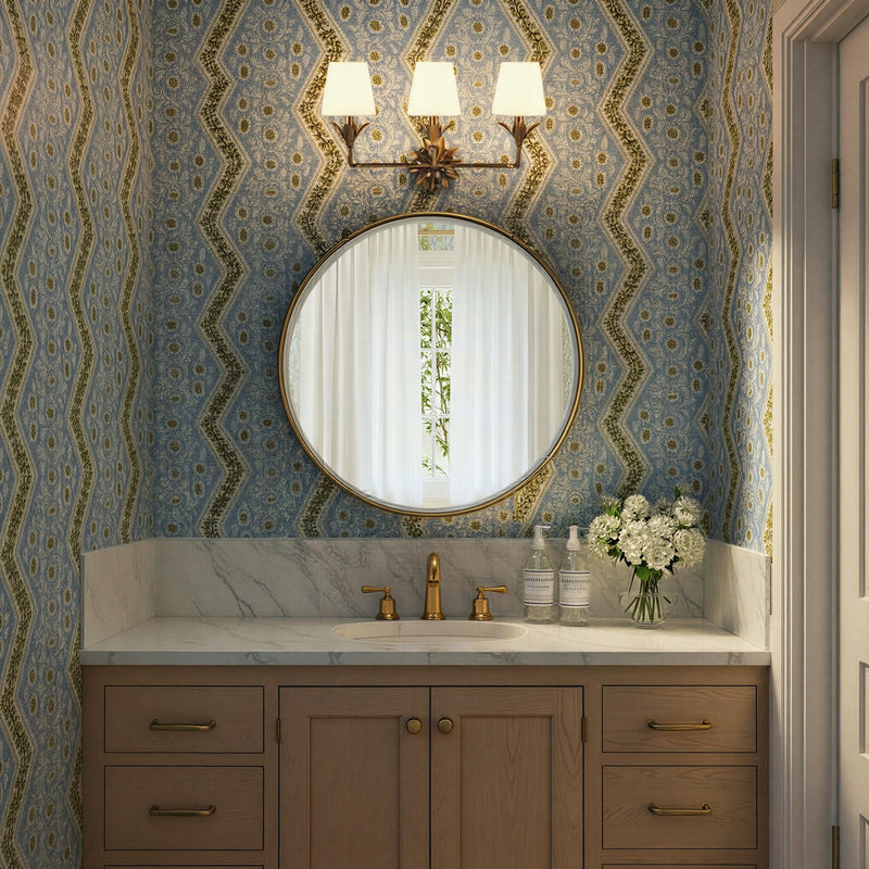 Broche 3 Light 25" Bathroom Vanity in Antique Gold in a room setting