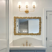 Broche 3 Light 25" Bathroom Vanity in Antique Gold in a room setting