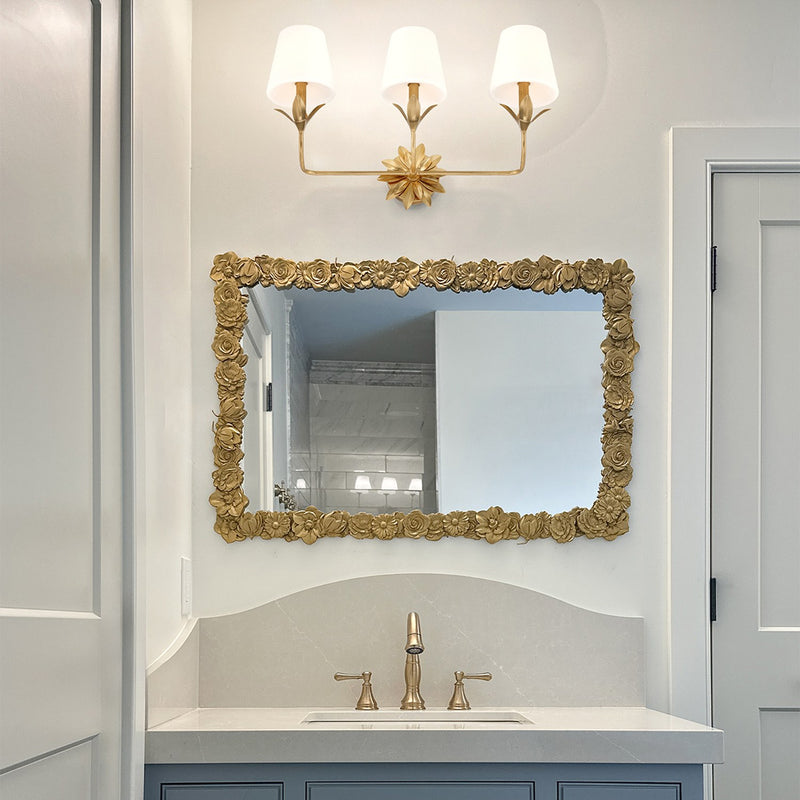 Broche 3 Light 25" Bathroom Vanity in Antique Gold in a room setting