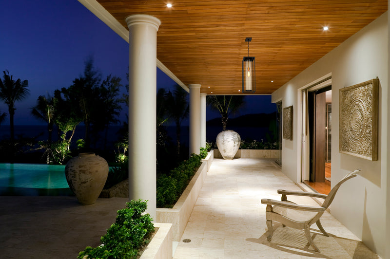 Dunbroch 1 Light 8" Outdoor Chain Mount Ceiling Fixture in Deep Bronze + Outdoor Brass in a room setting