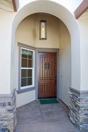 Dunbroch 1 Light 8" Outdoor Chain Mount Ceiling Fixture in Deep Bronze + Outdoor Brass in a room setting